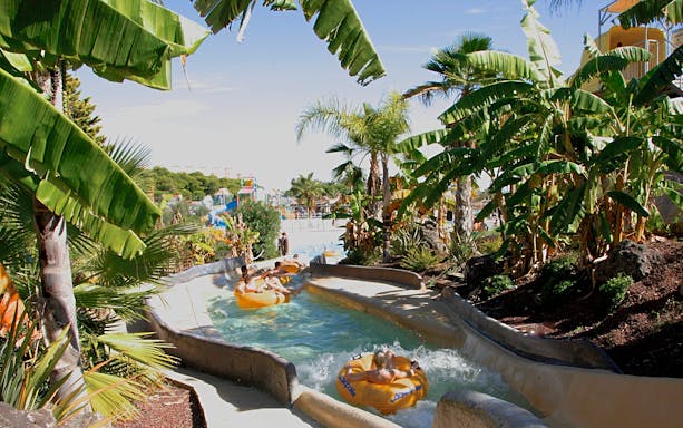 Visitors enjoying a lazy river ride at Aquopolis Costa Daurada, Tarragona water park.