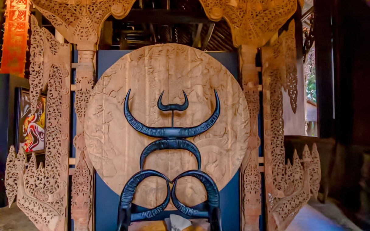 Intricate wooden carvings and sculptures inside Black House (Baan Dam), Chiang Rai.
