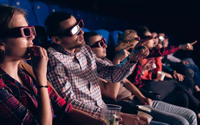 Visitors wearing 3D glasses at Cosmocaixa theatre, Barcelona.