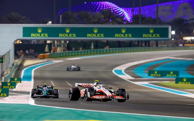 Race cars on track at Formula 1 Abu Dhabi Grand Prix, Yas Marina Circuit.