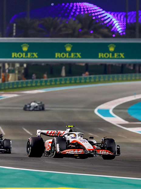 Race cars on track at Formula 1 Abu Dhabi Grand Prix, Yas Marina Circuit.