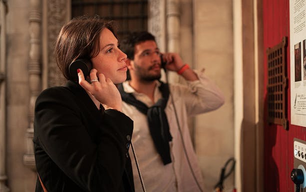 Visitors using audioguides at Quake Earthquake Museum, Lisbon.