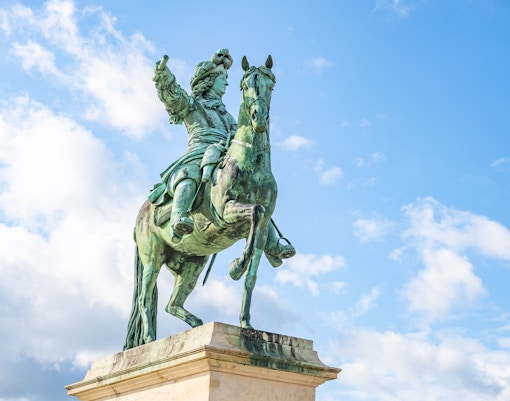 Equestrian statue of Louis XIV in front of the palace of Versailles