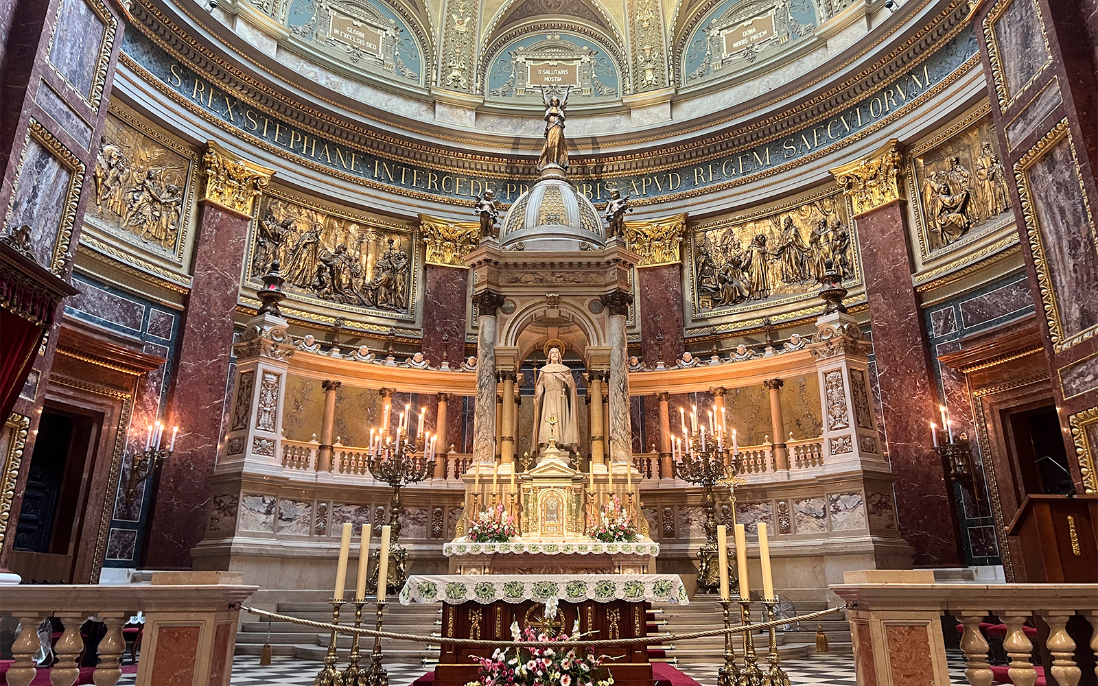St. Stephen's Basilica interior with ornate altar and statue, Budapest.