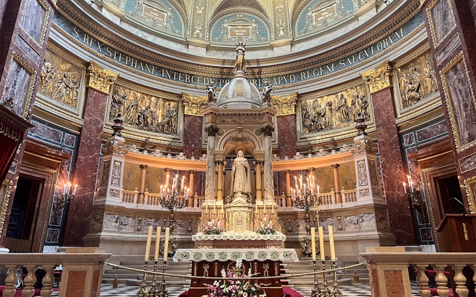 St. Stephen's Basilica interior with ornate altar and statue, Budapest.