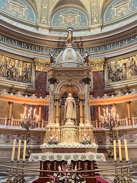 St. Stephen's Basilica interior with ornate altar and statue, Budapest.