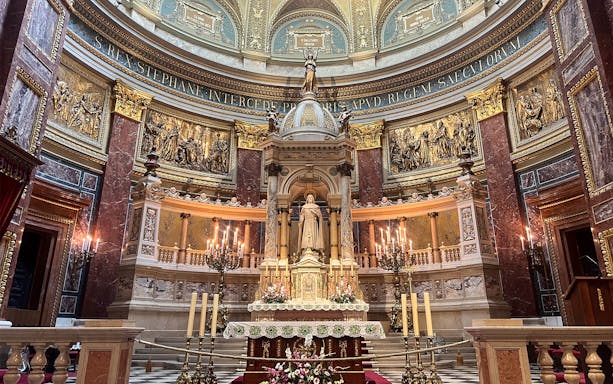 St. Stephen's Basilica interior with ornate altar and statue, Budapest.