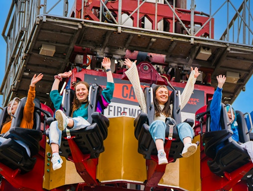 Visitors enjoying a drop tower ride at Thorpe Park.