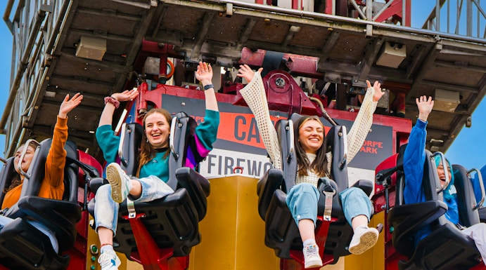 Visitors enjoying a drop tower ride at Thorpe Park.