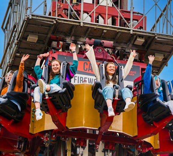 Visitors enjoying a drop tower ride at Thorpe Park.