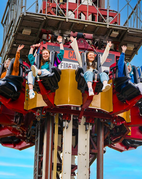 Visitors enjoying a drop tower ride at Thorpe Park.