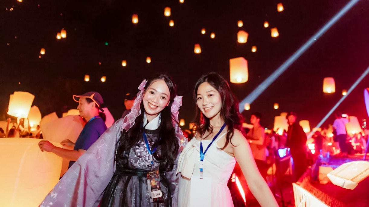 Group releasing lanterns at Yipeng Lantern Festival, Chiang Mai, Thailand.