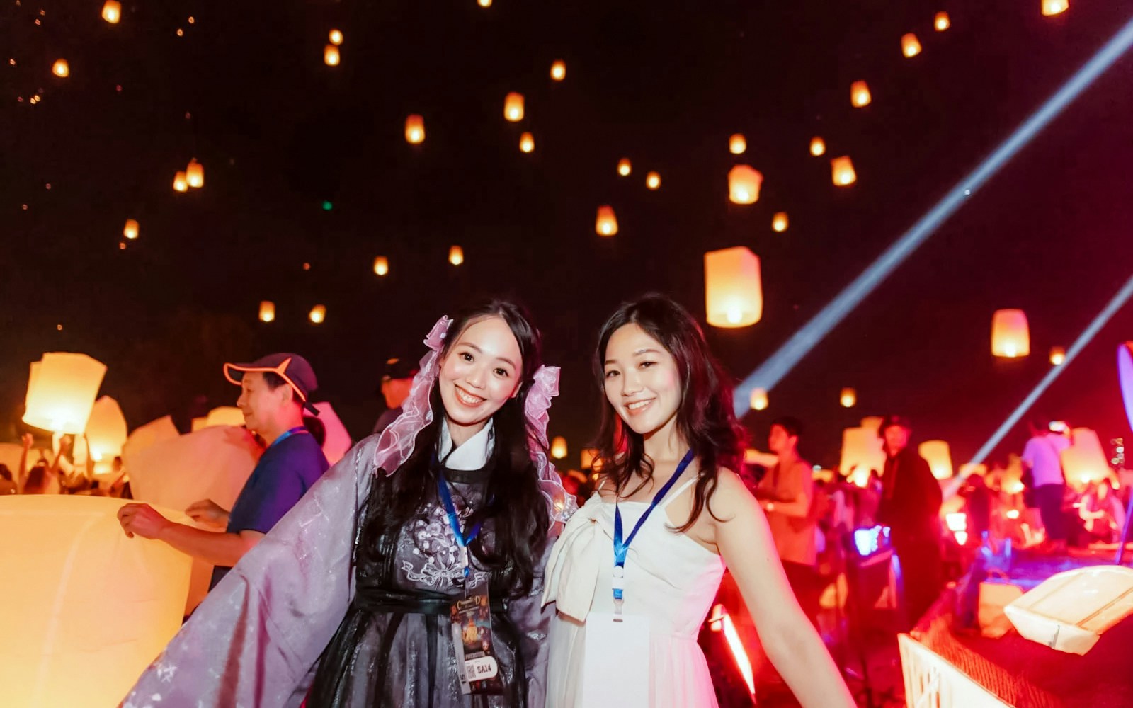 Group releasing lanterns at Yipeng Lantern Festival, Chiang Mai, Thailand.