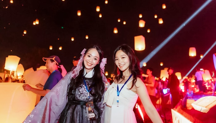 Group releasing lanterns at Yipeng Lantern Festival, Chiang Mai, Thailand.