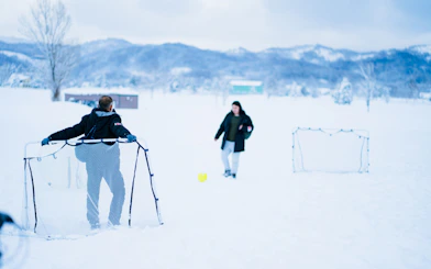 People playing soccer in the snow during Sapporo to Bibai Snow Land tour, Hokkaido.