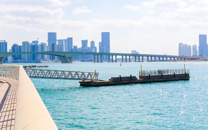 City skyline with towers and skyscrapers viewed from Saadiyat Island, Abu Dhabi.