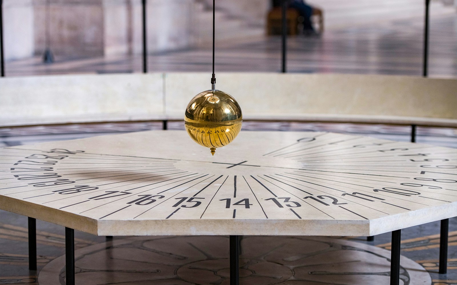 Foucault’s Pendulum inside the Paris Pantheon with detailed architectural features.