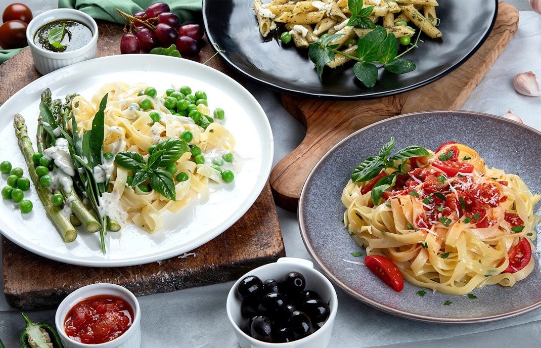 Vegan pasta dish with cherry tomatoes and basil in Rome, Italy.