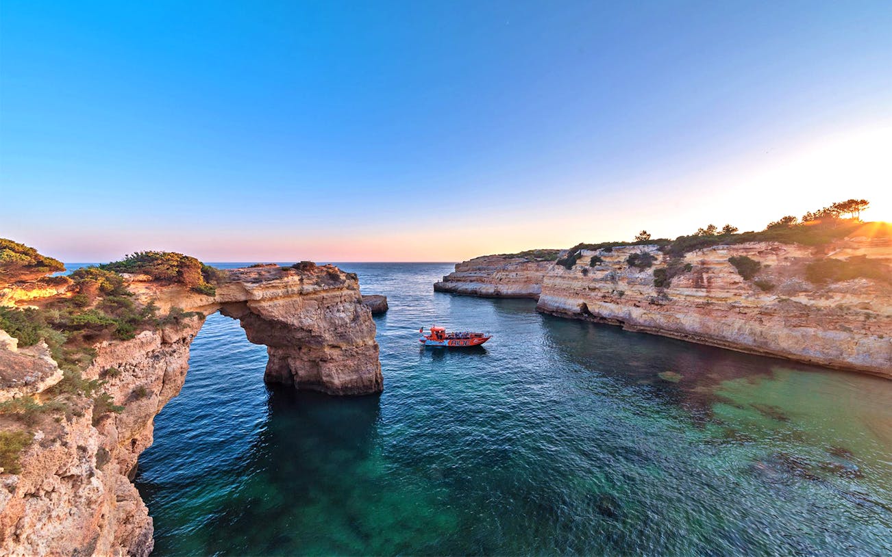 Boat near Benagil Caves during guided tour from Albufeira, Portugal.
