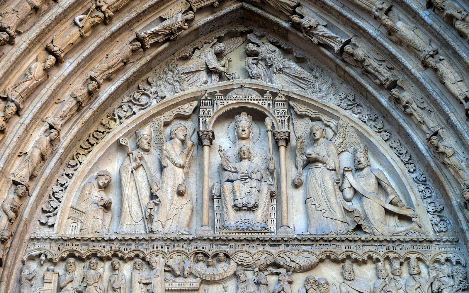 Chapel of St. Anne interior, Notre Dame, Paris, showcasing ornate altar and stained glass windows.