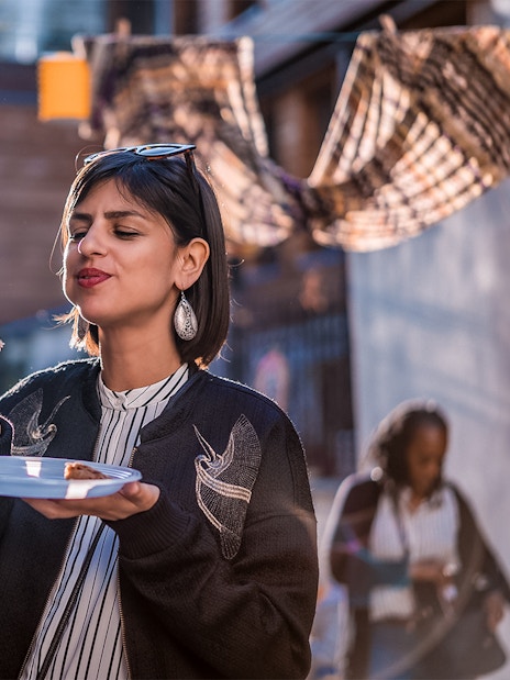 Eating escargot on a street in Montmartre, Paris during a food tour.