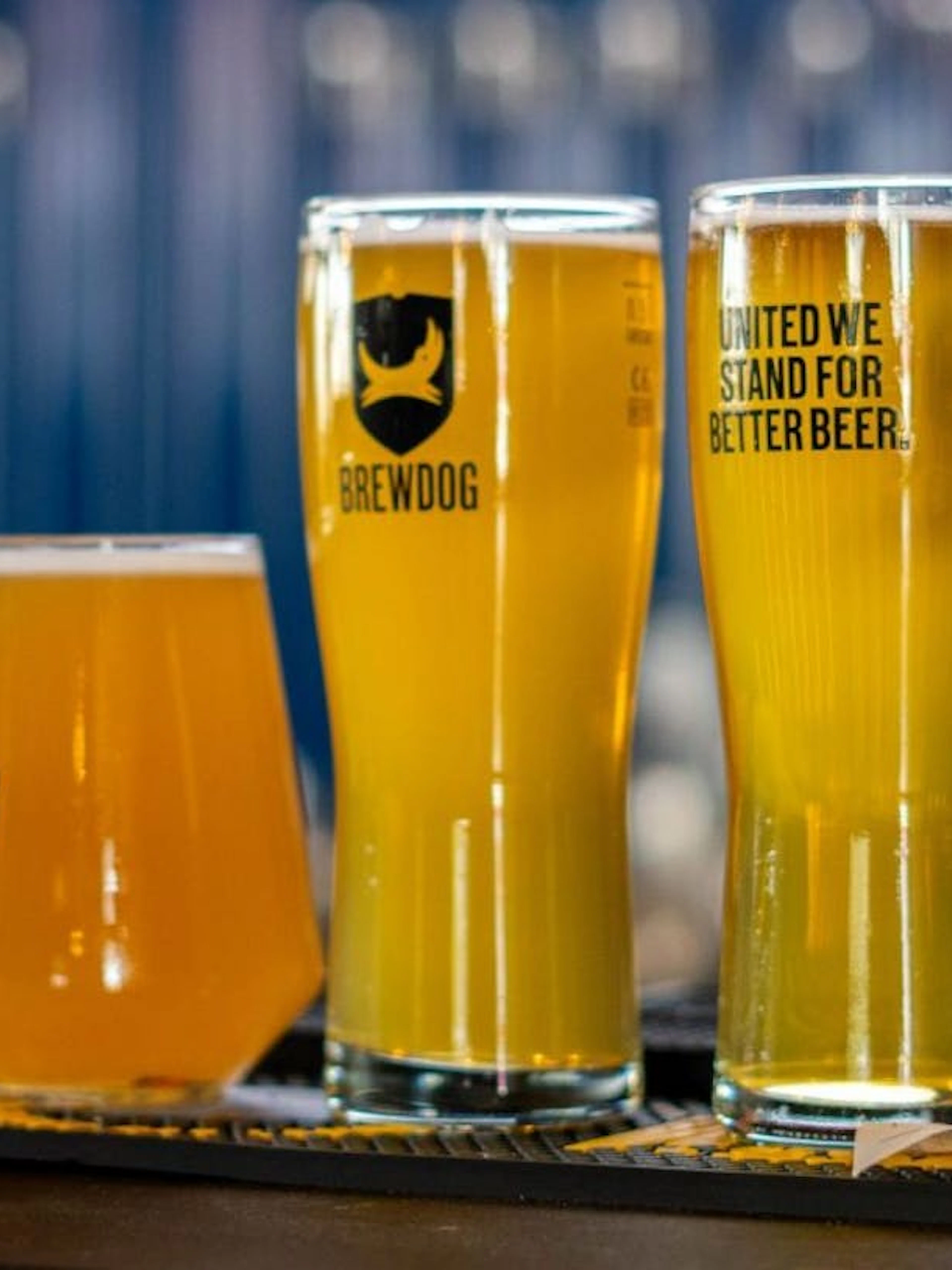 Beer flight with three glasses at BrewDog Dubai.