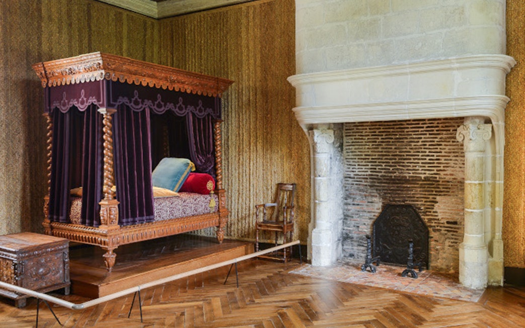 Canopy bed and fireplace in the Renaissance Room, Azay-le-Rideau, France.