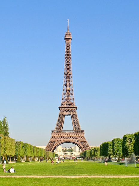Eiffel Tower with surrounding gardens in Paris, viewed from Champ de Mars.