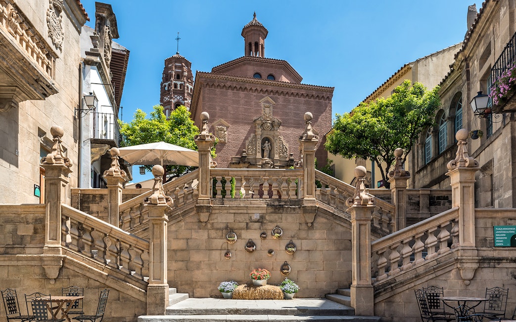 Stone staircase and historic architecture in Poble Espanyol, Barcelona.