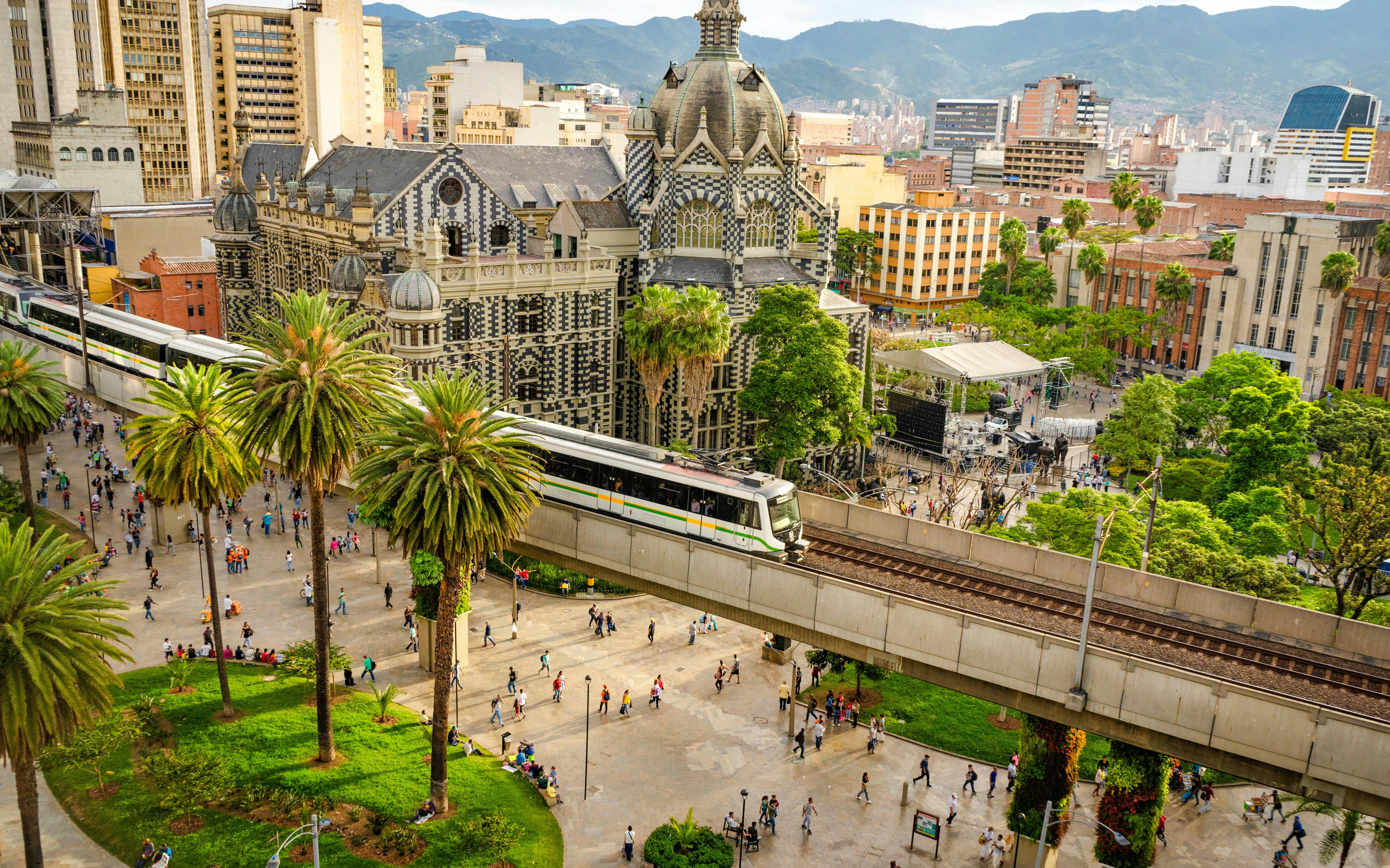 Train passing by the Palace of Culture in Medellín, Colombia.