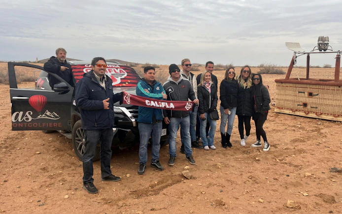 Group preparing for Marrakesh sunrise hot air balloon flight with camel ride.