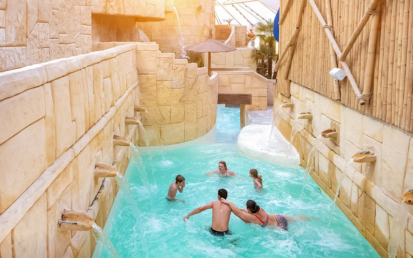 Tourists enjoying the water rapids at Aqualibi.