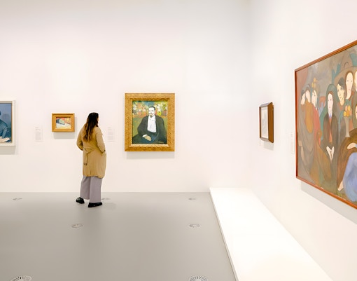 Visitor viewing Picasso paintings at The Picasso Century exhibition, National Gallery of Victoria.