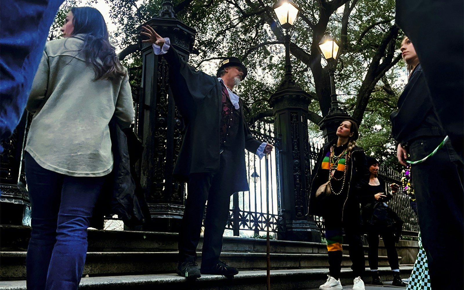 Guided tour group exploring New Orleans haunted sites on a ghost, voodoo, and vampire tour.