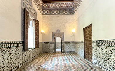 Corridor with intricate tile patterns inside Alcazar, Seville.
