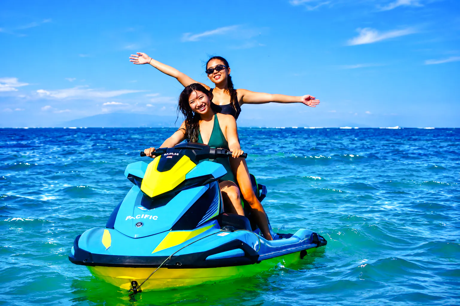 Jet skiing adventure in Tanjung Benoa, Bali with two people enjoying the ocean.