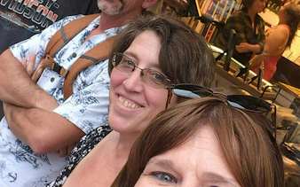 Self-guided city exploration game participants in New Orleans bookstore.