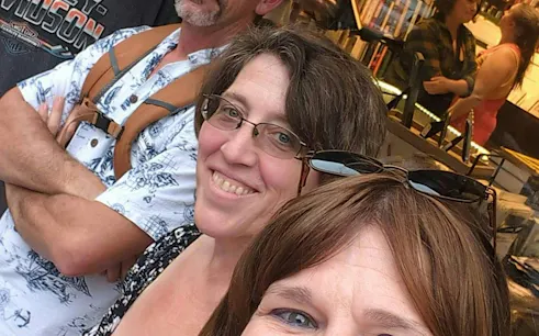 Self-guided city exploration game participants in New Orleans bookstore.