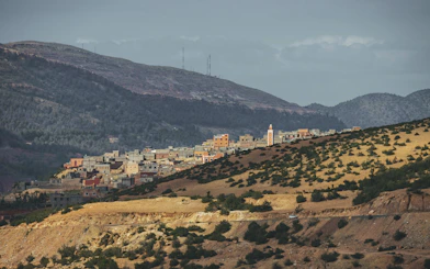 Panoramic view of Foum Jamaa village with Atlas Mountains backdrop, Morocco.