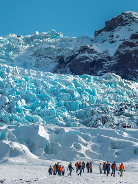 Group of people on a glacier expedition at Vatnajökull, Iceland.