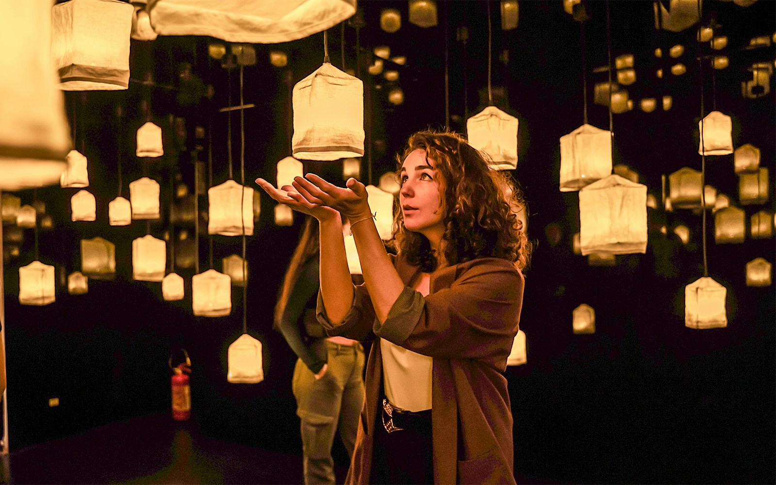 Visitors exploring interactive art installations at Ikono Madrid.