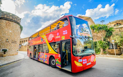 City sightseeing hop-on hop-off bus in front of Pueblo Español, Mallorca.