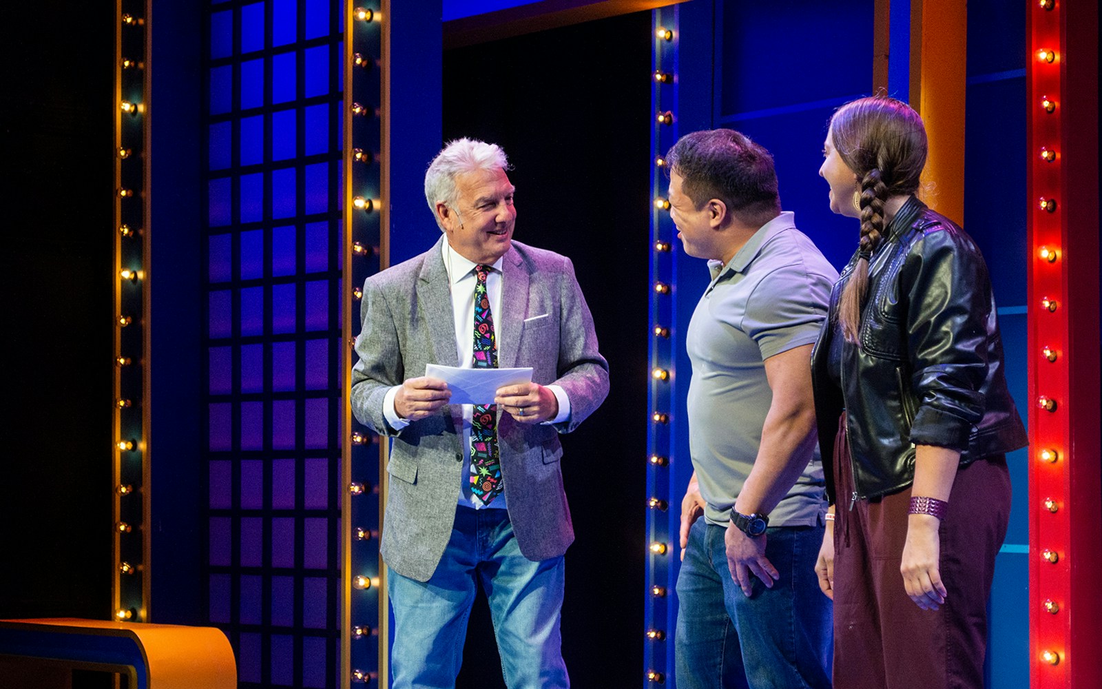Host interacting with guests on stage during The Life and Slimes of Marc Summers show.