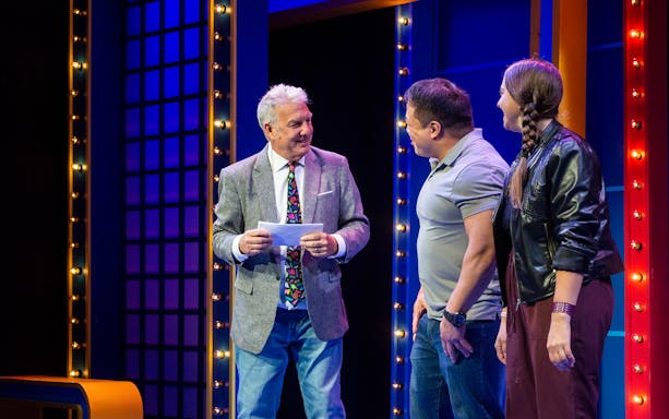 Host interacting with guests on stage during The Life and Slimes of Marc Summers show.