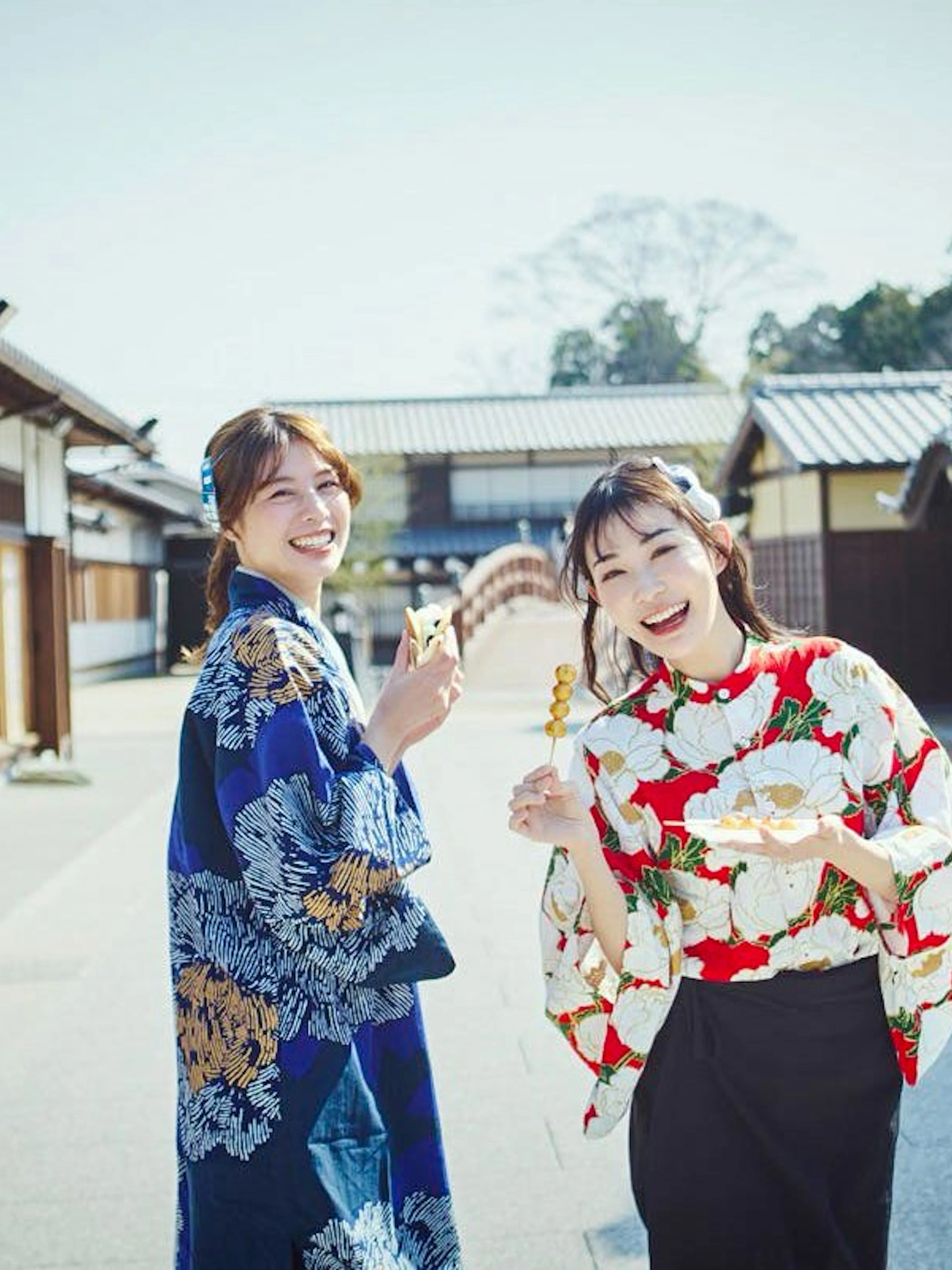 Visitors in traditional attire enjoying snacks at TOEI Kyoto Studio Park.