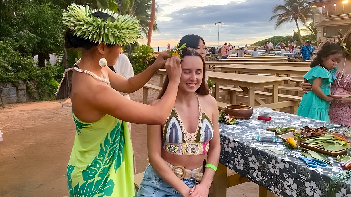 Traditional Hawaiian dancers performing at Germaine's Luau pre-show cultural activities, Oahu, Hawaii.