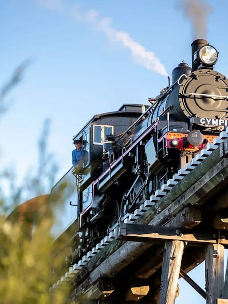 Mary Valley Rattler steam train crossing a wooden bridge near Gympie.