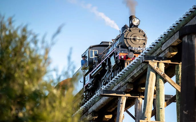 Mary Valley Rattler steam train crossing a wooden bridge near Gympie.