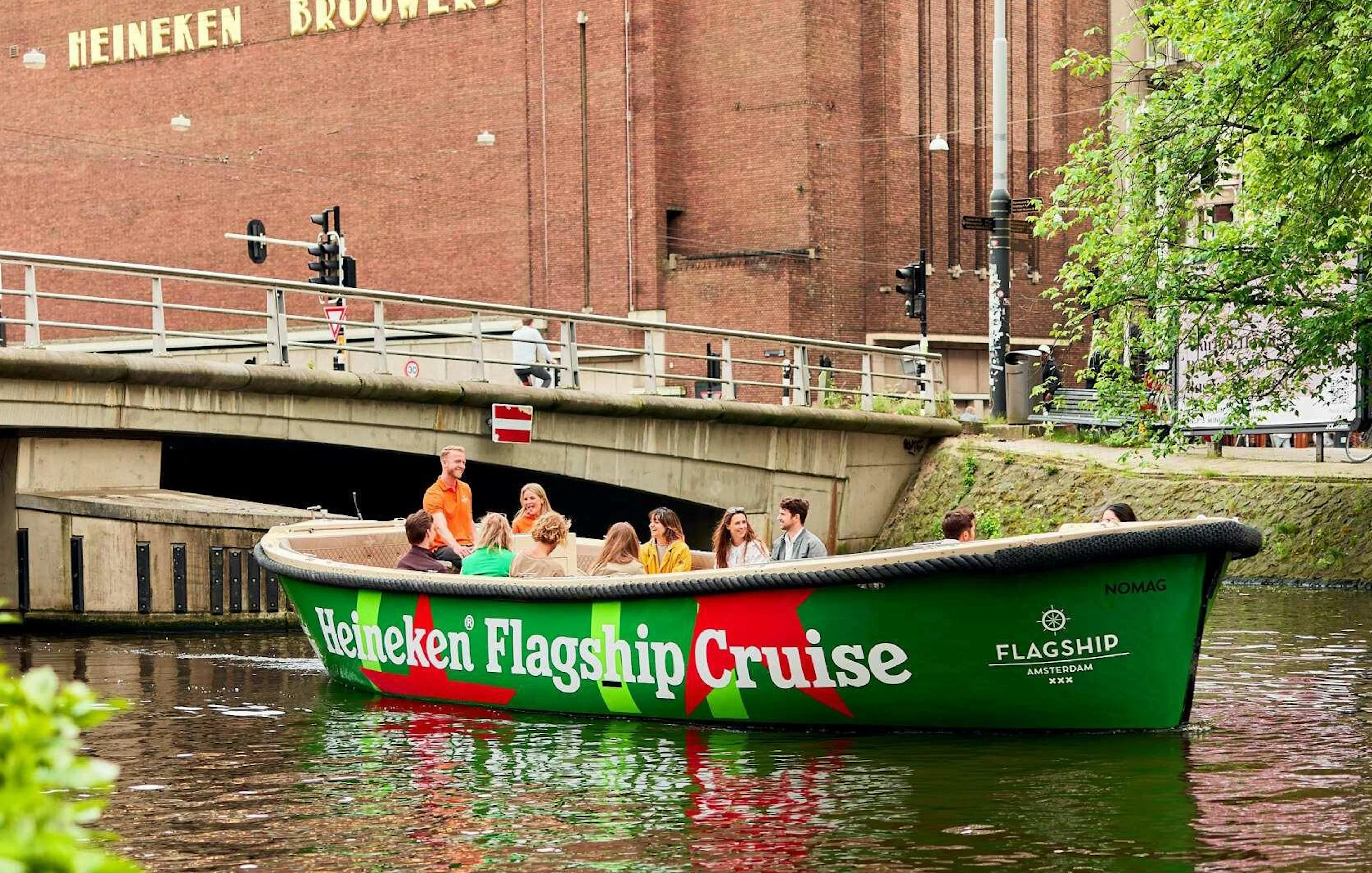 Guests enjoying Heineken Flagship Cruise on Amsterdam canal.