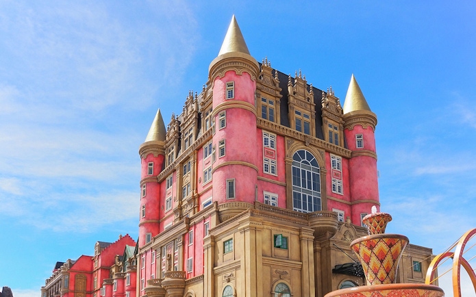 Luna Castle with pink towers and golden spires in Ba Na Hills, Da Nang, Vietnam.